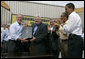 President George W. Bush holds the box after signing the Transportation Equity Act, with the help of Speaker of the House Dennis Hastert, R-Ill., at the Caterpillar facility in Montgomery, Ill., Wednesday, Aug. 10, 2005. Also pictured from left are Congressman Bill Thomas, R-Calif., Congressman Bobby Rush, D-Ill., and Senator Barack Obama, D-Ill. White House photo by Eric Draper