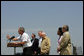  President George W. Bush addresses the media at his Crawford, TX ranch flanked by members of Defense Policy and Programs Team, Secretary of State, and Foreign Policy Team Thursday, August 11, 2005. White House photo by David Bohrer