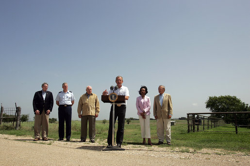 President George W. Bush addresses the media at his Crawford, Texas ranch flanked by members of Defense Policy and Programs Team, Secretary of State, and Foreign Policy Team Thursday, August 11, 2005. White House photo by David Bohrer