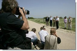 President George W. Bush talks with the media Thursday, Aug. 11, 2005, at the Bush Ranch in Crawford, Texas, after meeting with the Defense and Foreign Policy teams.  White House photo by Eric Draper