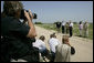 President George W. Bush talks with the media Thursday, Aug. 11, 2005, at the Bush Ranch in Crawford, Texas, after meeting with the Defense and Foreign Policy teams. White House photo by Eric Draper
