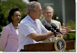 President George W. Bush briefs the media after meetings with the Defense and Foreign Policy teams Thursday, Aug. 11, 2005, at the Bush Ranch in Crawford, Texas. Secretary of State Condoleezza Rice and Secretary of Defense Donald Rumsfeld look on.  White House photo by Eric Draper