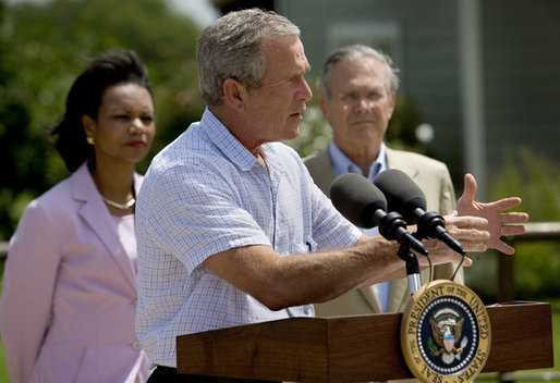 President George W. Bush briefs the media after meetings with the Defense and Foreign Policy teams Thursday, Aug. 11, 2005, at the Bush Ranch in Crawford, Texas. Secretary of State Condoleezza Rice and Secretary of Defense Donald Rumsfeld look on. White House photo by Eric Draper