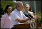 President George W. Bush briefs the media after meetings with the Defense and Foreign Policy teams Thursday, Aug. 11, 2005, at the Bush Ranch in Crawford, Texas. Secretary of State Condoleezza Rice and Secretary of Defense Donald Rumsfeld look on. White House photo by Eric Draper