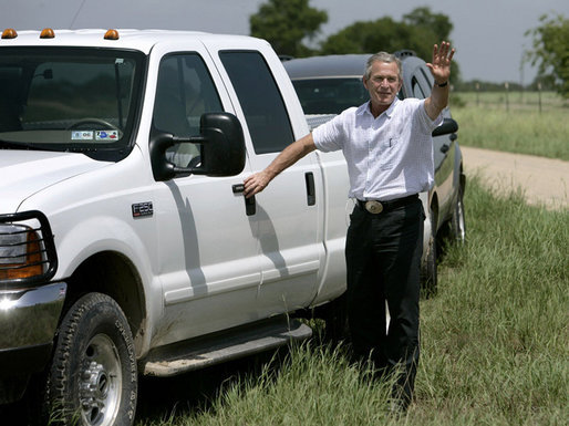 President George W. Bush waves goodbye to the media as he leaves a press availability Thursday, Aug. 11, 2005, at the Bush Ranch in Crawford, Texas. White House photo by Eric Draper