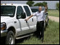 President George W. Bush waves goodbye to the media as he leaves a press availability Thursday, Aug. 11, 2005, at the Bush Ranch in Crawford, Texas. White House photo by Eric Draper
