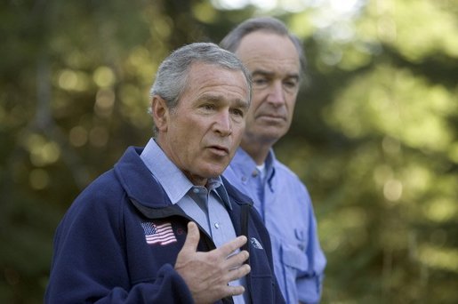 Standing with Idaho Governor Dirk Kempthorne, President George W. Bush talks with the press in Donnelly, Idaho, Tuesday, Aug. 23, 2005. White House photo by Paul Morse