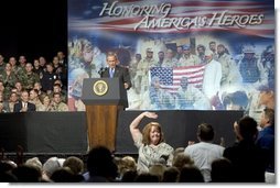 The mother of four sons currently deployed to Iraq, Tammy Pruett, acknowledges the applause of the crowd at Idaho Center Arena, Wednesday, Aug. 24, 2005 in Nampa, Idaho, after she is introduced by President George W. Bush.  White House photo by Paul Morse