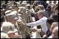President George W. Bush shakes hands with troops at Luke Air Force Base Monday, Aug. 29, 2005, after his arrival in Arizona, where he spoke on Medicare to 400 guests at the Pueblo El Mirage RV Resort and Country Club in nearby El Mirage. White House photo by Paul Morse