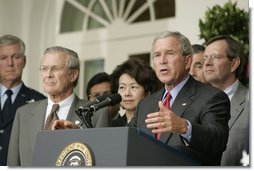 President George W. Bush stands with Secretary of Defense Donald Rumsfeld; Secretary of Labor Elaine Chao and Mike Leavitt, Secretary of Health and Human Services, as he speaks to the media from the Rose Garden of the White House regarding the devastation along the Gulf Coast caused by Hurricane Katrina.  White House photo by Paul Morse