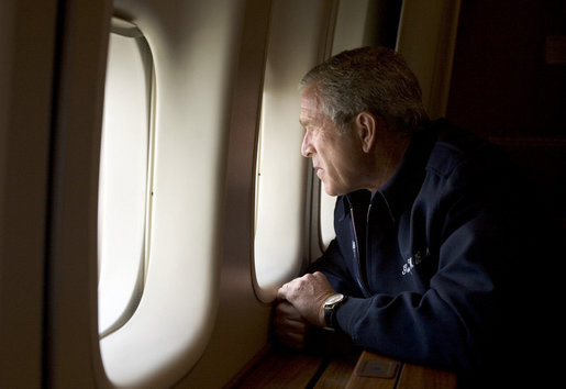 President George W. Bush looks out over the devastation in New Orleans from Hurricane Katrina as he heads back to Washington D.C. Wednesday, Aug. 31, 2005, aboard Air Force One. White House photo by Paul Morse