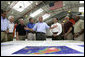 President George W. Bush talks about Hurricane Katrina disaster relief with, from left: Senator Trent Lott, R-Miss.; Senator Thad Cochran, R-Miss.; Mississippi Governor Haley Barbour; Alabama Governor Bob Riley; FEMA Director Mike Brown; Michael Chertoff, Secretary of Homeland Security, and Alphonso Jackson, Secretary of Housing and Urban Development. The President briefed the officials during his tour Friday, Sept. 2, 2005, of the Gulf Coast regions hard hit by the storm. White House photo by Eric Draper