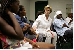 Laura Bush visits with people affected by Hurricane Katrina in the Cajundome at the University of Louisiana in Lafayette, La., Friday, Sept. 2, 2005.  White House photo by Krisanne Johnson