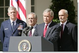 President George W. Bush speaks to the nation during a weekly radio address, live from the Rose Garden at the White House in Washington, D.C., September 3, 2005. Accompanying the president are (L to R) Chairman of the Joint Chiefs of Staff, General Richard Myers, Secretary of Defense Donald Rumsfeld and Homeland Secretary Michael Chertoff.  White House photo by Paul Morse