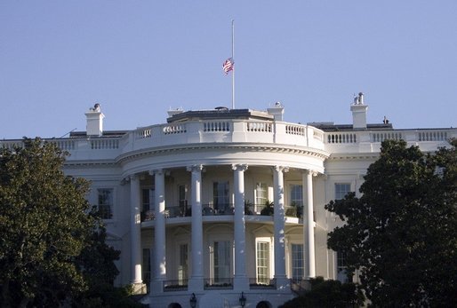The United States flag flies at half-staff in honor of the death of Supreme Court Justice William Rehnquist, and as a mark of respect for the victims of Hurricane Katrina. White House photo by Paul Morse
