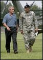 President George W. Bush and U.S. Army Lt General Russel Honore walk to the Emergency Operations Center, Monday, Sept. 5, 2005, after the President's arrival in Baton Rouge, La. White House photo by Eric Draper
