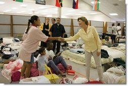 Laura Bush visits people affected by Hurricane Katrina at the Bethany World Prayer Center shelter, Monday, Sept. 5, 2005 in Baton Rouge, Louisiana, where hundreds of people have taken refuge.  White House photo by Krisanne Johnson