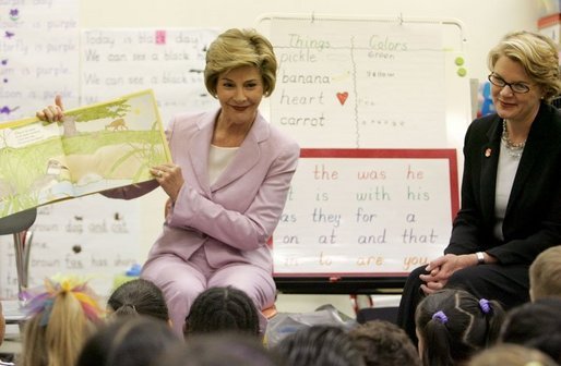 Laura Bush is joined by U.S. Education Secretary Margaret Spellings, right, as she reads a book to first graders at Lovejoy Elementary School in Des Moines, Iowa, Thursday, September 8, 2005. White House photo by Krisanne Johnson