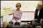 Laura Bush is joined by U.S. Education Secretary Margaret Spellings, right, as she reads a book to first graders at Lovejoy Elementary School in Des Moines, Iowa, Thursday, September 8, 2005. White House photo by Krisanne Johnson