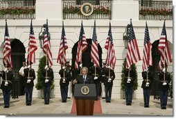 President George W. Bush gestures as he addresses guests on the South Lawn of the White House, Friday, Sept. 9, 2005, during the 9/11 Heroes Medal of Valor Award Ceremony and to honor the courage and commitment of emergency services personnel who died on Sept. 11, 2001.  White House photo by Paul Morse