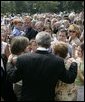 President George W. Bush meets some of the hundreds of family and friends who gathered on the South Lawn of the White House, Friday, Sept. 9, 2005, during the 9/11 Heroes Medal of Valor Award ceremony, in honor of the courage and commitment of emergency services personnel who died on Sept. 11, 2001. White House photo by Eric Draper