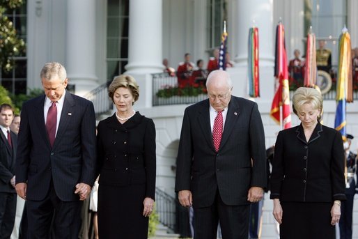 President Bush stands with Laura Bush, Vice President Dick Cheney and Mrs. Cheney as they observe a moment of silence, on the South Lawn, in honor of 9/11 victims September 11, 2005. This marks the fourth anniversary of terrorist attacks on both the World Trade Center and The Pentagon. White House photo by Krisanne Johnson