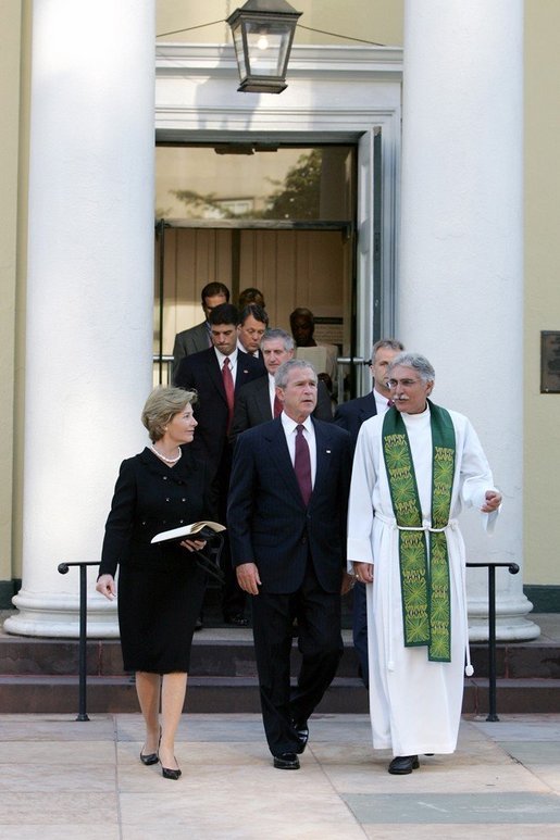 President Bush and First Lady Laura Bush walk with Rev. Luis Leon after attending a Service of Prayer and Remembrance for 9/11 victims at St. John's Episcopal Church in Washington, DC, September 11, 2005. This marks the fourth anniversary of terrorist attacks on both the World Trade Center and The Pentagon. White House photo by David Bohrer