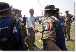 President George W. Bush greets aid workers from Mexico helping in the hurricane ravaged areas in Gulfport, Miss., Monday, Sept. 12, 2005. White House photo by Paul Morse