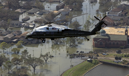 President George W. Bush flies over the hurricane ravaged neighborhoods of New Orleans, La., in Marine One, Monday, Sept. 12, 2005. White House photo by Paul Morse
