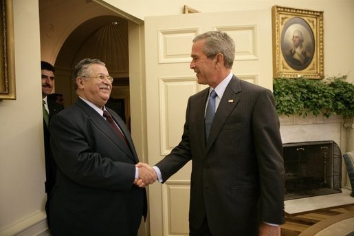 President George W. Bush welcomes President Jalal Talabani of Iraq into the Oval Office, Tuesday, Sept. 13. 2005 at the White House in Washington. White House photo by Eric Draper