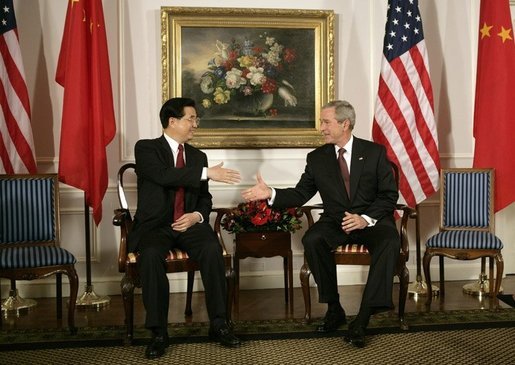 President George W. Bush and President Hu Jintao of China greet each other at the start of their meeting, Tuesday, Sept. 13, 2005, in New York. White House photo by Eric Draper