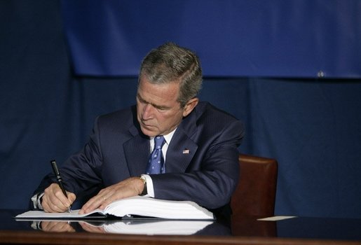  President George W. Bush signs the Convention for the Suppression of Acts of Nuclear Terrorism Treaty at the United Nations in New York Wednesday, Sept. 14, 2005. White House photo by Eric Draper