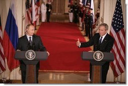 President George W. Bush and Russian President Vladimir Putin appear together at a joint news conference in the East Room of the White House, Friday, Sept. 16, 2005 in Washington, where President Bush thanked Putin for Russia's offers of assistance in the wake of Hurricane Katrina.  White House photo by Eric Draper