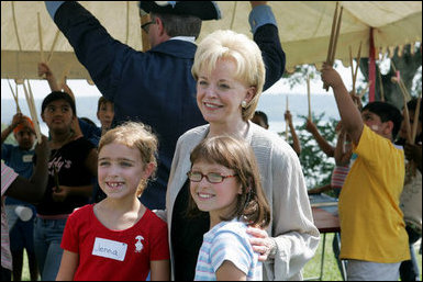 Lynne Cheney poses for photos with children at George Washington's Mount Vernon Estate.