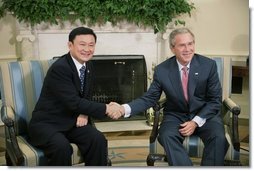President George W. Bush shakes hands with Thailand's Prime Minister Thaksin Shinawatra, during a visit to the Oval Office at the White House, Monday, Sept. 19, 2005 in Washington.  White House photo by Eric Draper
