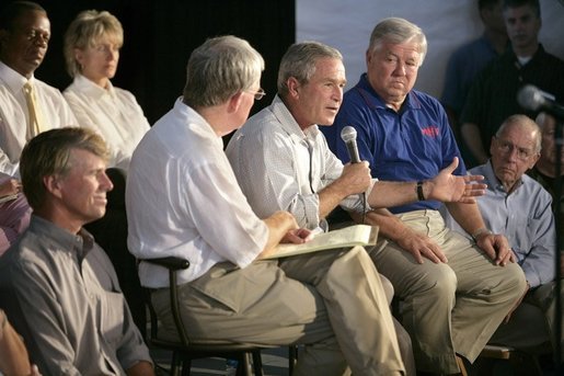 President George W. Bush speaks during a meeting with local officials and business leaders, including Mississippi Governor Haley Barbour, right, in Gulfport, Miss., Tuesday, Sept. 20, 2005. White House photo by Eric Draper