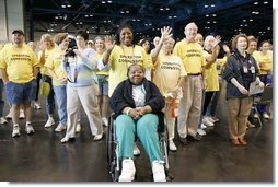 "Operation Compassion" volunteers wave to First Lady Laura Bush Monday, Sept. 19, 2005, as she visited Houston's George R. Brown Convention Center. The Convention Center was designated a shelter for Hurricane Katrina evacuees and since opening its doors Sept. 2, more than 35,000 have been served and approximately 46,000 volunteers have been trained.  White House photo by Krisanne Johnson