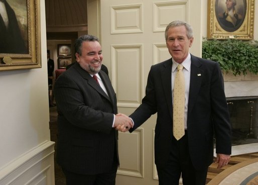 President George W. Bush welcomes Hajim al-Hasani, the Speaker of Iraq's Transitional National Assembly, into the Oval Office, Wednesday, Sept. 21, 2005 at the White House in Washington. White House photo by Paul Morse