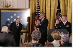 Korean War era veteran Corporal Tibor "Ted" Rubin, receives a standing ovation, after being presented the Medal of Honor by President George W. Bush, Friday, Sept. 23, 2005 at cermonies at the White House in Washington. Rubin was honored for his actions under fire, and his bravery while in captivity at a Chinese POW camp.  White House photo by Krisanne Johnson
