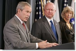 President George W. Bush, appearing at the U.S. Department of Energy, Monday, Sept. 26, 2005 in Washington, talks about the effects of Hurricane Rita on the energy situation in the Gulf of Mexico. President Bush is joined by U.S. Energy Secretary Samuel W. Bodman and U.S. Interior Secretary Gale Norton.  White House photo by Paul Morse