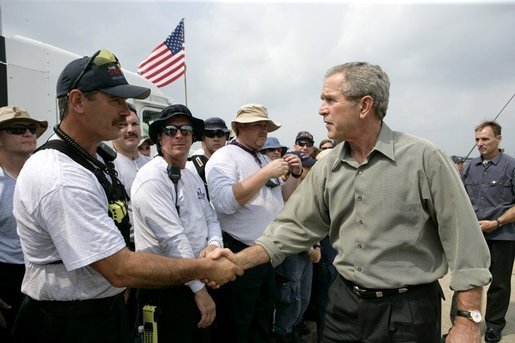 President George W. Bush greets members of the Ohio Urban Search and Rescue Unit during his visit Tuesday, Sept. 27, 2005 to Lake Charles, La. It was the President's seventh visit to the Gulf Coast area since Hurricane Katrina. White House photo by Eric Draper