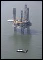 Marine One, carrying President George W. Bush, flies past an oil rig in the Gulf of Mexico near Cameron, La., during an aerial tour Tuesday, Sept. 27, 2005, of recent hurricane damage. White House photo by Eric Draper