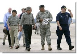 President George W. Bush speaks with Lt. Gen. Russel Honore after arriving Tuesday, Sept. 27, 2005, in Lake Charles, La., for a meeting with state officials. With them are Lake Charles Mayor Randy Roach, left, and U.S. Coast Guard Vice Admiral Thad Allen.  White House photo by Eric Draper
