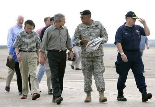 President George W. Bush speaks with Lt. Gen. Russel Honore after arriving Tuesday, Sept. 27, 2005, in Lake Charles, La., for a meeting with state officials. With them are Lake Charles Mayor Randy Roach, left, and U.S. Coast Guard Vice Admiral Thad Allen. White House photo by Eric Draper