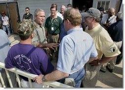 President George W. Bush speaks with Texas officials following a meeting about hurricane Rita at South Texas Regional Airport in Beaumont, Texas, Tuesday, Sept. 27, 2005.  White House photo by Eric Draper