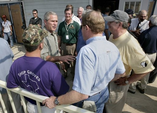 President George W. Bush speaks with Texas officials following a meeting about hurricane Rita at South Texas Regional Airport in Beaumont, Texas, Tuesday, Sept. 27, 2005. White House photo by Eric Draper