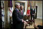 President George W. Bush stands in the Roosevelt Room of the White House with Judge John Roberts Thursday, Sept. 29, 2005, after the Senate vote confirming Judge Roberts as the 17th Chief Justice of the United States was announced on television. White House photo by Paul Morse