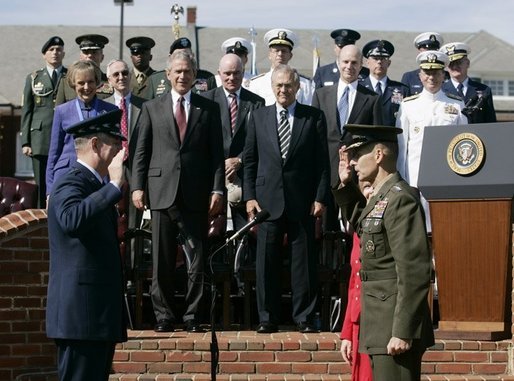 General Richard B. Myers, left, swears-in General Peter Pace, Friday, Sept. 30, 2005, as the new Chairman of the Joint Chiefs of Staff, during The Armed Forces Farewell Tribute in Honor of General Myers and the Armed Forces Hail in Honor of General Pace at Fort Myer's Summerall Field in Ft. Myer, Va., with President George W. Bush, Defense Secretary Donald Rumsfeld looking on. White House photo by Shealah Craighead
