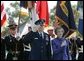 General Richard B. Myers salutes as he stands with his wife, Mary Jo Myers, Friday, Sept. 30, 2005, during ceremonies at theThe Armed Forces Farewell Tribute in Honor of General Richard B. Myers and the Armed Forces Hail in Honor of General Peter Pace at Fort Myer's Summerall Field in Ft. Myer, Va. White House photo by David Bohrer