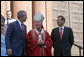 President George Bush walks out of St. Matthew's Cathedral with Cardinal Theodore McCarrick and Supreme Court Chief Justice John Roberts after attending the 52nd Annual Red Mass in Washington, DC, Sunday, October 2, 2005. The Red Mass, a historical tradition within the Catholic Church, is held on the Sunday before the opening session of the Supreme Court. White House photo by Shealah Craighead